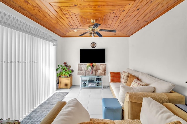 tiled living room featuring ceiling fan, wood ceiling, and crown molding