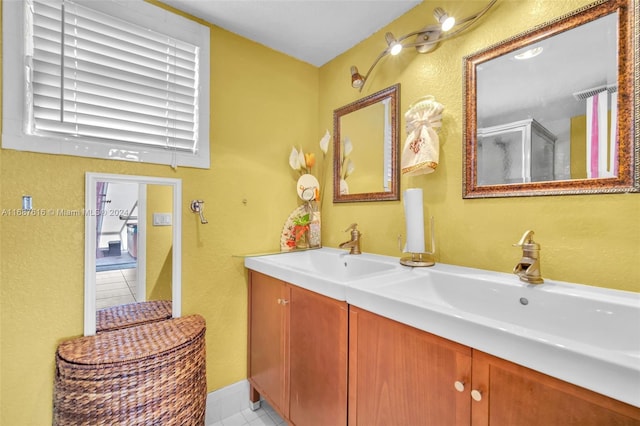 bathroom featuring tile patterned flooring and vanity