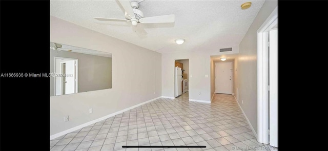 unfurnished room featuring light tile patterned flooring, a textured ceiling, and ceiling fan