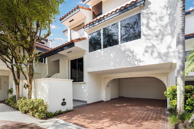 mediterranean / spanish-style house with a garage