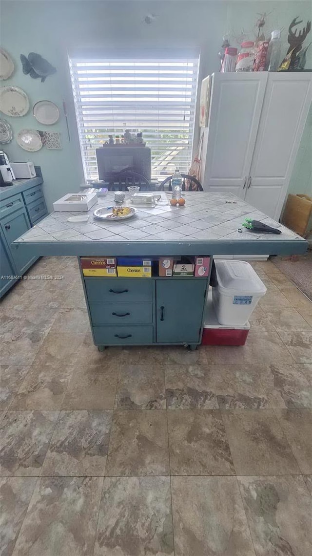 dining space with stone finish flooring