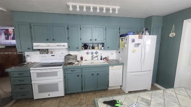 kitchen featuring sink, exhaust hood, white appliances, and tasteful backsplash