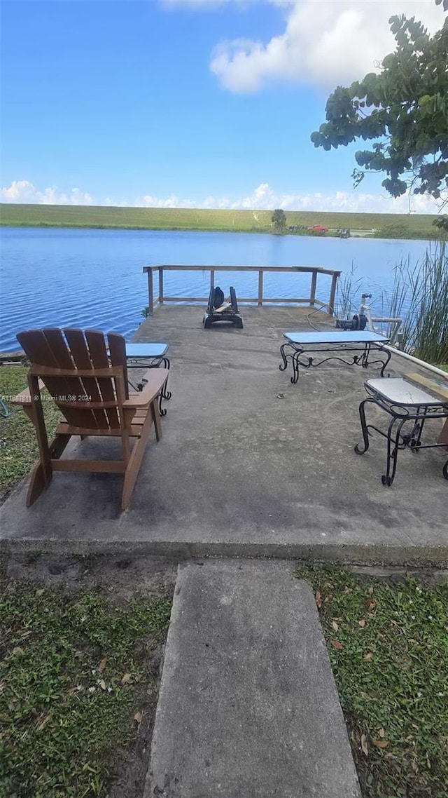 dock area featuring a water view