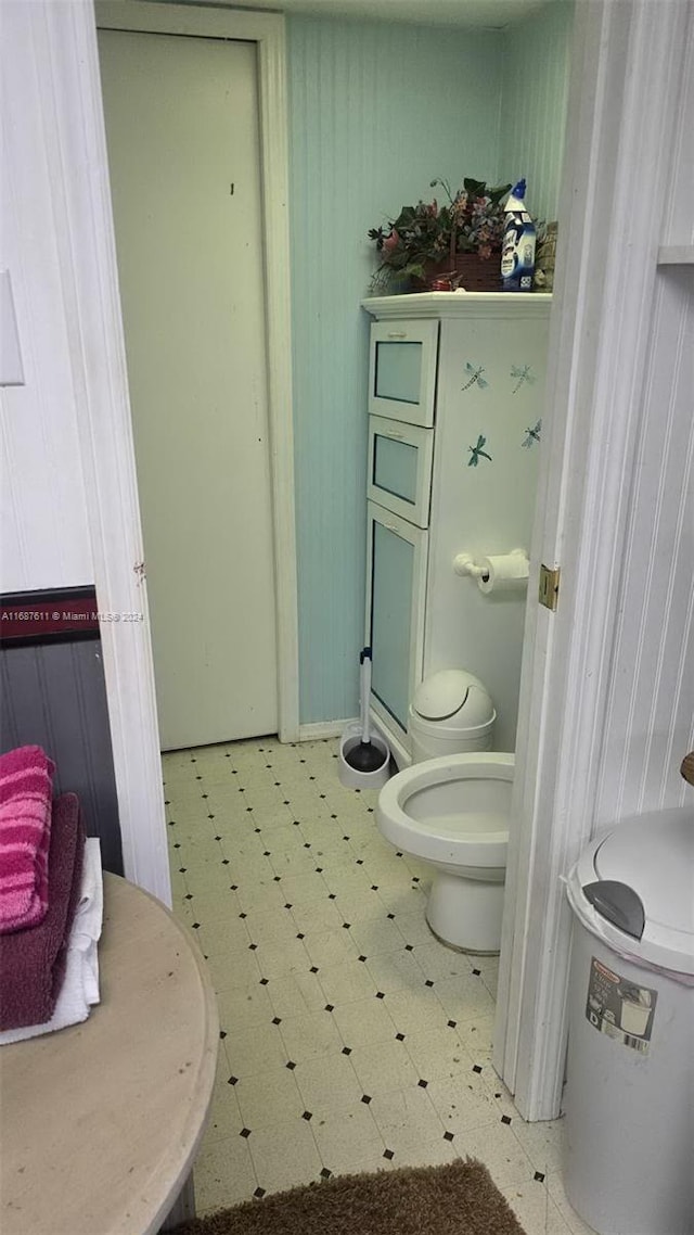 bathroom featuring tile patterned floors and toilet