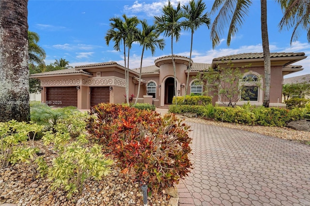 mediterranean / spanish-style house featuring a garage