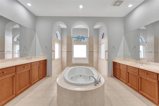 bathroom featuring vanity, tile patterned floors, and independent shower and bath