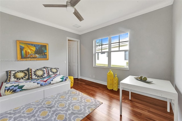 bedroom featuring ornamental molding, dark wood-type flooring, and ceiling fan