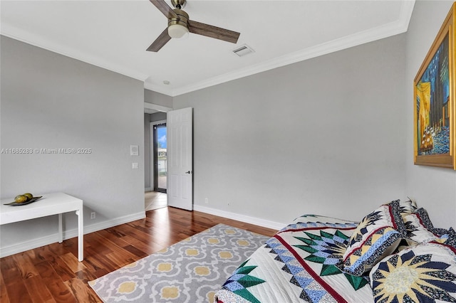 bedroom featuring wood-type flooring, ornamental molding, and ceiling fan