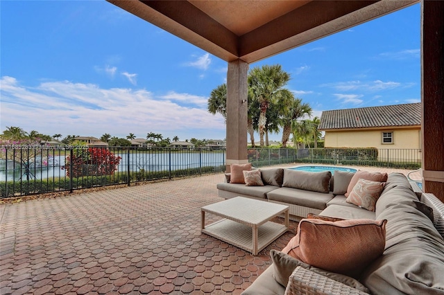 view of patio / terrace featuring an outdoor living space and a water view