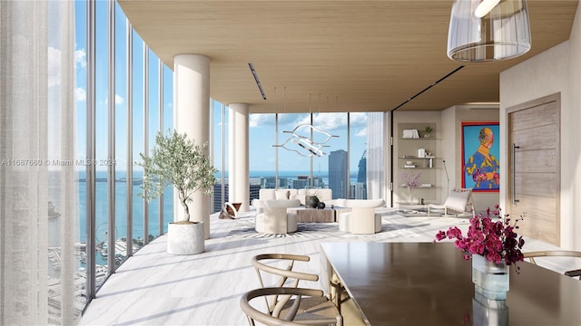 interior space featuring a water view and a balcony