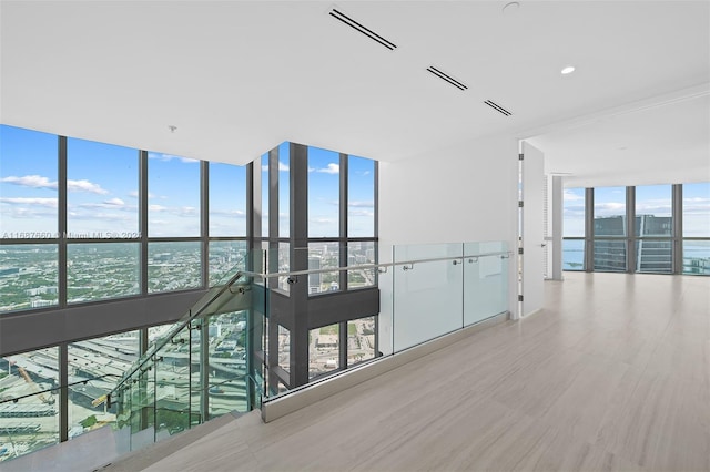 hallway with expansive windows and a wealth of natural light