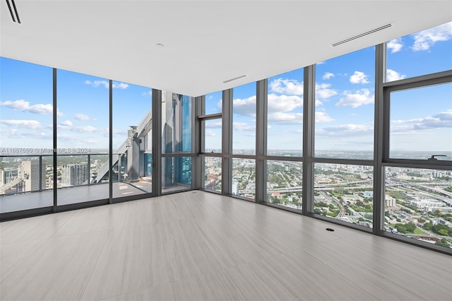 spare room featuring floor to ceiling windows