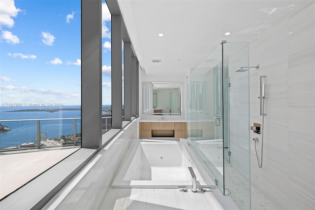 bathroom with vanity, tile patterned flooring, a water view, and separate shower and tub