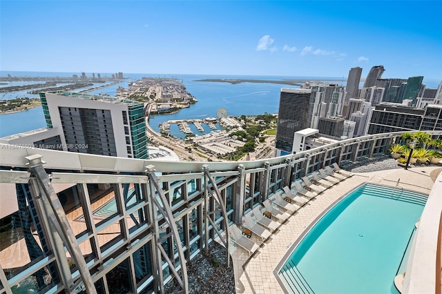 view of swimming pool with a water view