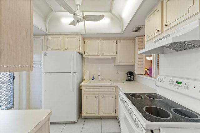 1333 E Hallandale Beach Blvd Unit 409, Hallandale Beach, FL 33009 - kitchen featuring white appliances, under cabinet range hood, cream cabinetry, ceiling fan, and light countertops