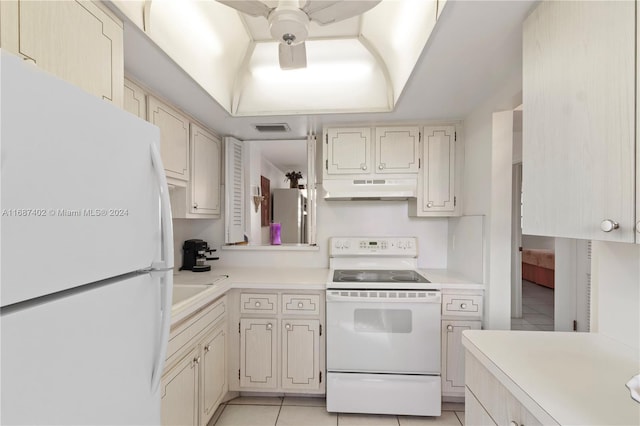 1333 E Hallandale Beach Blvd Unit 409, Hallandale Beach, FL 33009 - kitchen featuring white appliances, under cabinet range hood, light tile patterned flooring, light countertops, and a ceiling fan