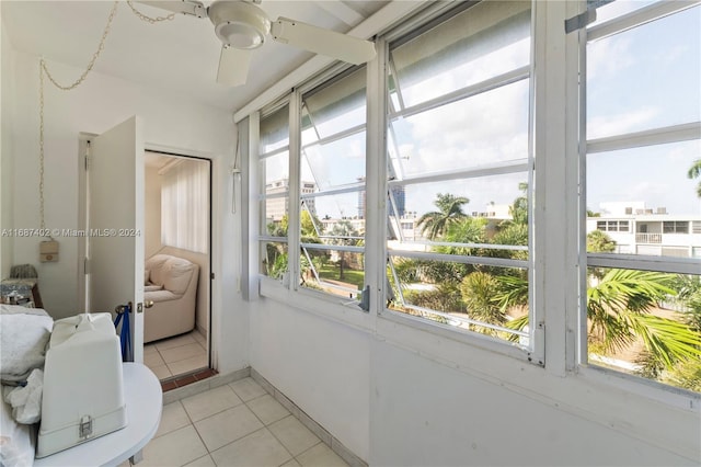 1333 E Hallandale Beach Blvd Unit 409, Hallandale Beach, FL 33009 - bedroom featuring light tile patterned floors, a closet, and ceiling fan