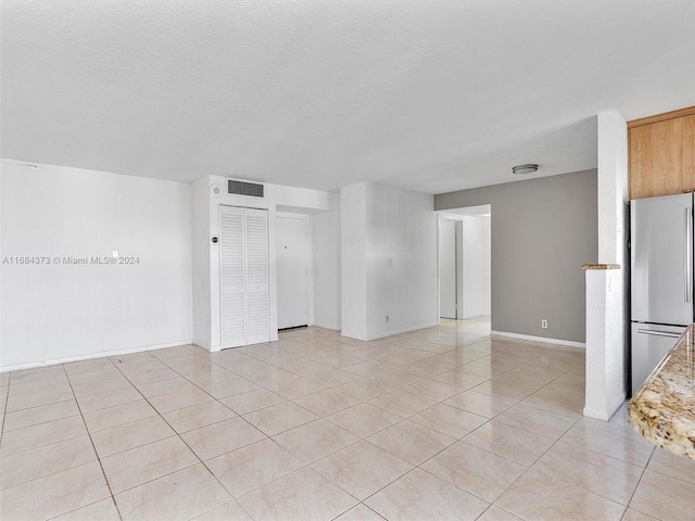 view of tiled spare room