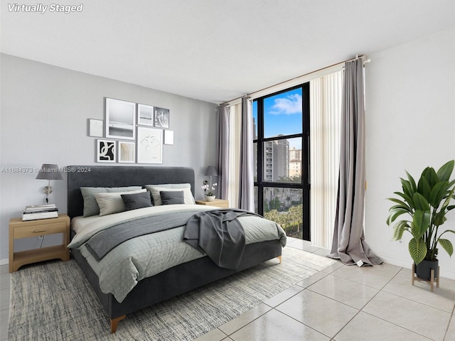 17021 N Bay Rd Unit 701, Sunny Isles Beach, FL 33160 - bedroom with light tile patterned flooring and expansive windows