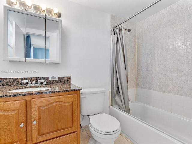 full bathroom with vanity, toilet, shower / bath combo with shower curtain, and tile patterned flooring