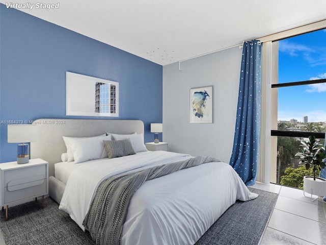 bedroom featuring multiple windows and tile patterned flooring