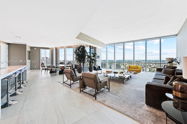 living room featuring floor to ceiling windows