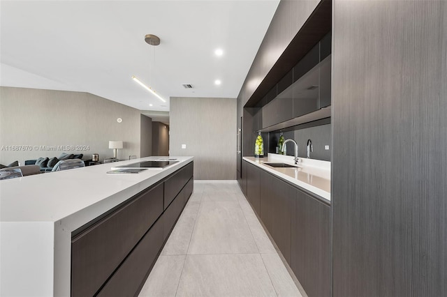 kitchen featuring sink and light tile patterned flooring