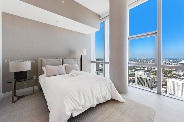 bedroom with expansive windows and multiple windows