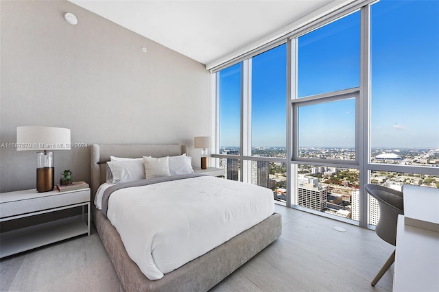 bedroom featuring a wall of windows