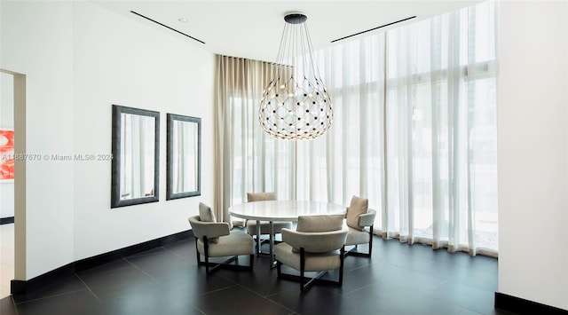 dining area featuring an inviting chandelier