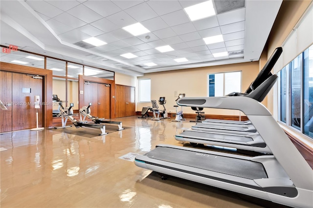 workout area with a paneled ceiling