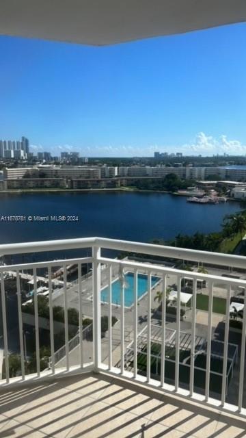 balcony featuring a water view