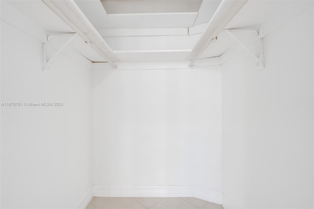 walk in closet featuring light tile patterned floors