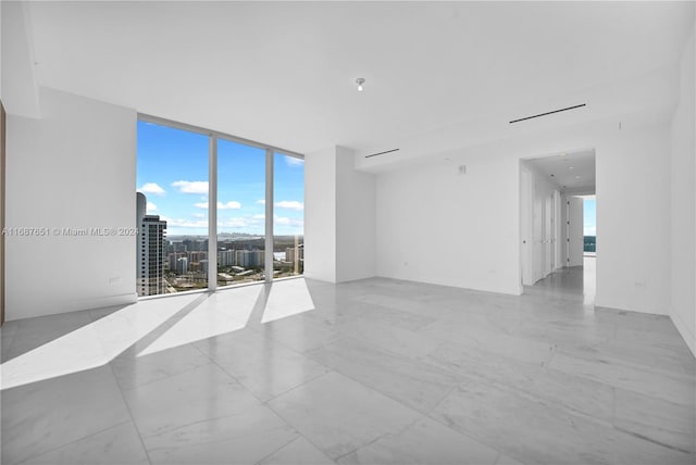 empty room featuring floor to ceiling windows