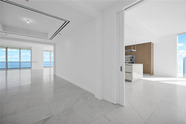 18501 Collins Ave Unit 4003/04, Sunny Isles Beach, FL 33160 - empty room featuring light marble finish flooring and baseboards