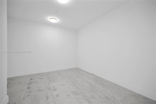 18501 Collins Ave Unit 4003/04, Sunny Isles Beach, FL 33160 - spare room featuring marble finish flooring and baseboards