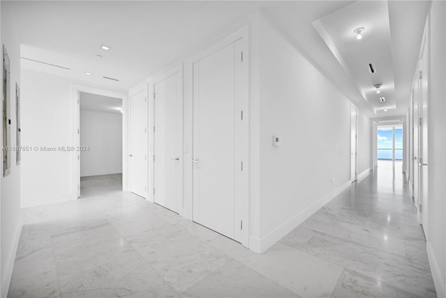18501 Collins Ave Unit 4003/04, Sunny Isles Beach, FL 33160 - hallway featuring light marble finish floors and baseboards