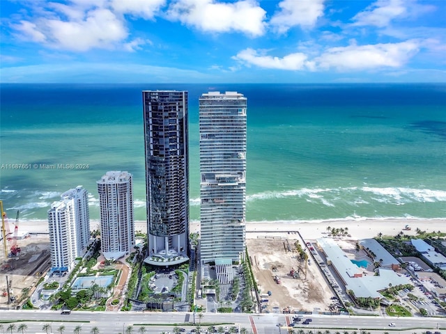 aerial view featuring a water view and a beach view