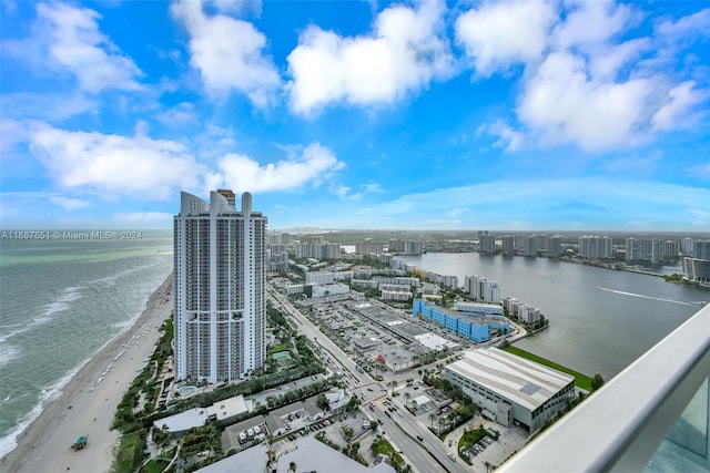 aerial view featuring a view of the beach and a water view