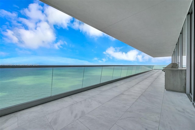 balcony featuring a water view