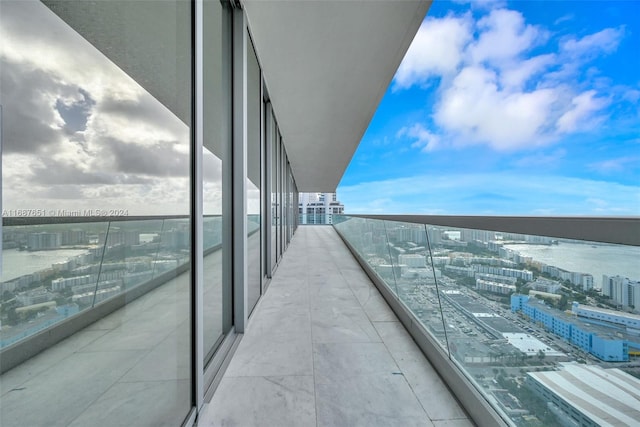 balcony featuring a water view