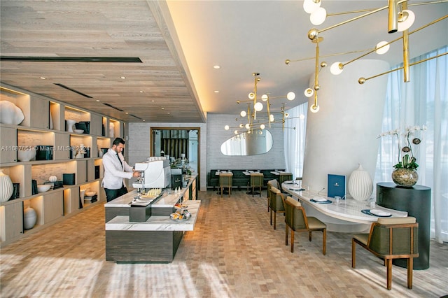 dining room with an inviting chandelier and wooden ceiling