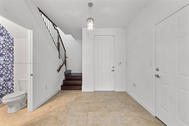 entrance foyer with light tile patterned floors