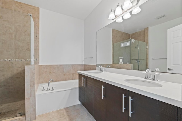 bathroom featuring vanity, independent shower and bath, and tile patterned flooring