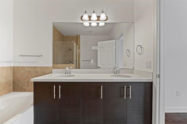 bathroom featuring vanity, tile patterned floors, and plus walk in shower