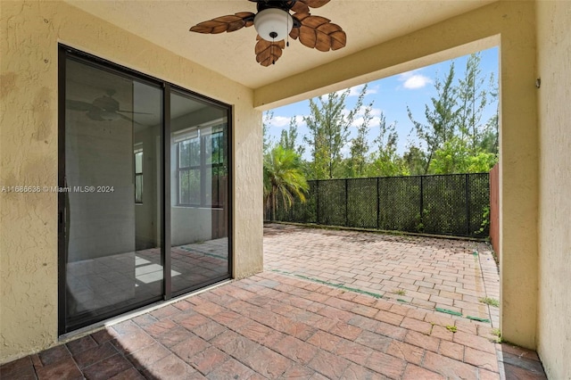 view of patio featuring ceiling fan