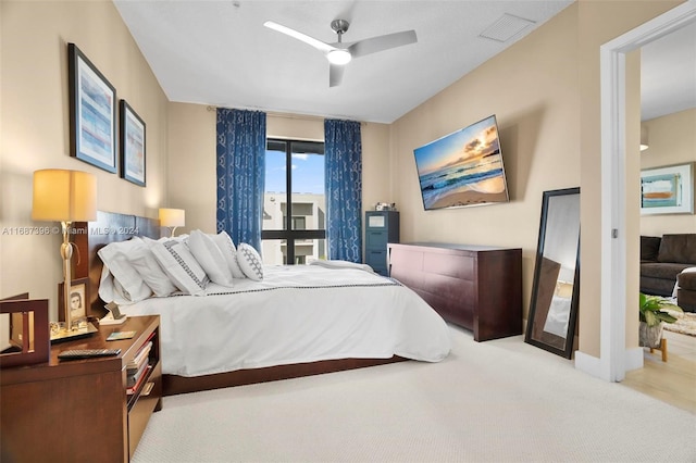 carpeted bedroom featuring ceiling fan