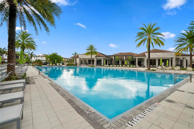 view of swimming pool with a patio