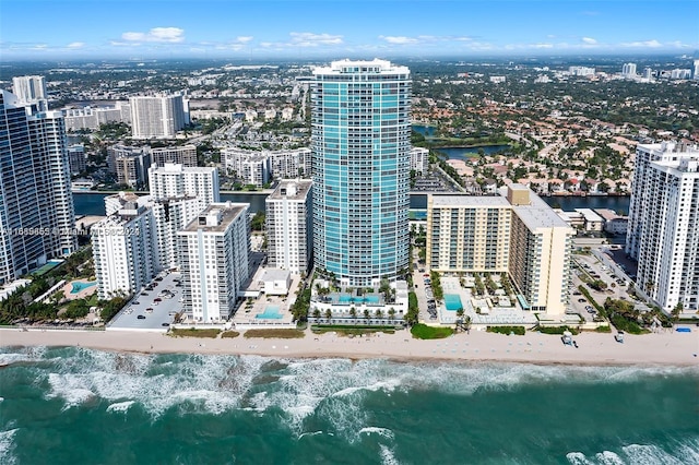 aerial view featuring a water view and a view of the beach