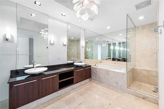 bathroom with vanity, ceiling fan, and plus walk in shower